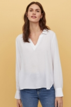 Blusa con escote de pico 10.99 €
