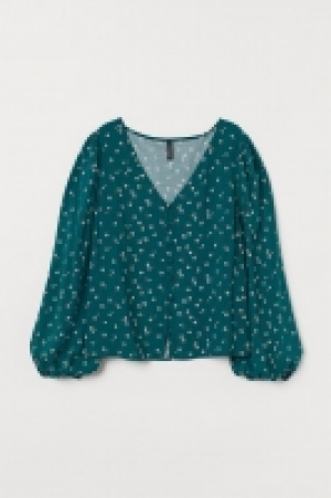 Blusa con mangas abullonadas 9.99 €