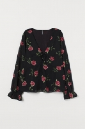 Blusa con tiras de anudar 8.99 €