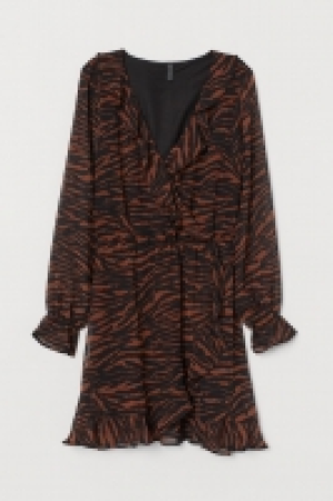 Vestido cruzado con volantes 9.99 €