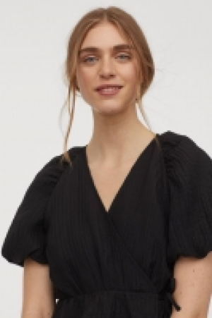 Blusa cruzada con lyocell 8.99 €