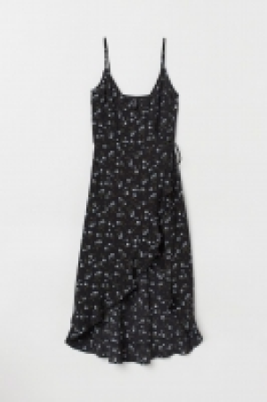 Vestido cruzado con volante 13.99 €