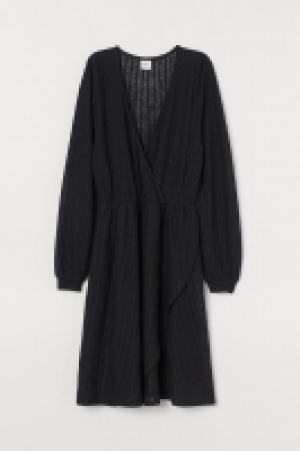 Vestido de punto en V 19.99 €