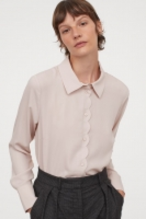 Blusa festoneada 12.99 €