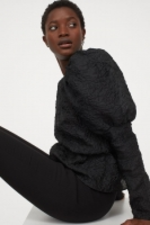 Blusa en tejido jacquard 14.99 €