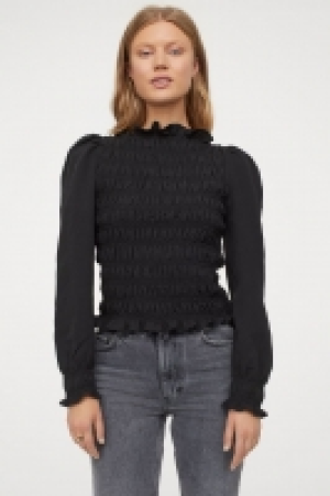 Blusa fruncida con manga puffy 10.99 €