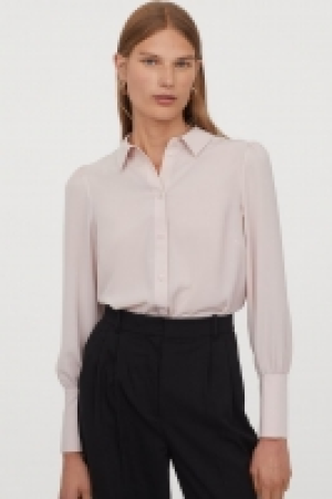 Blusa con mangas abullonadas 9.99 €