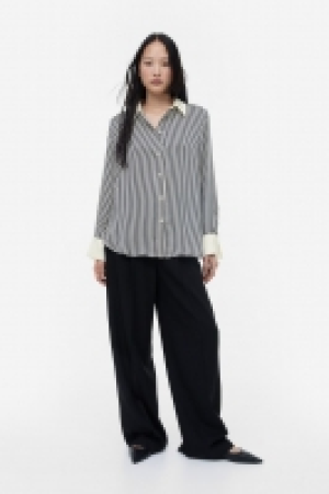 Camisa con cuello de pico 12.99 €