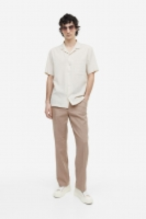 Pantalón en mezcla de lino Relaxed Fit 21.99 €