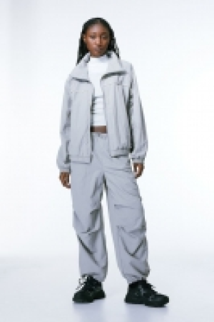 Pantalón parachute 6.99 €